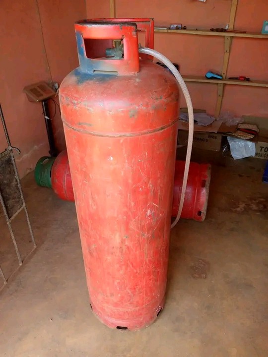 A 50kg LPG cooking-gas cylinder standing in a filling shop in Nigeria